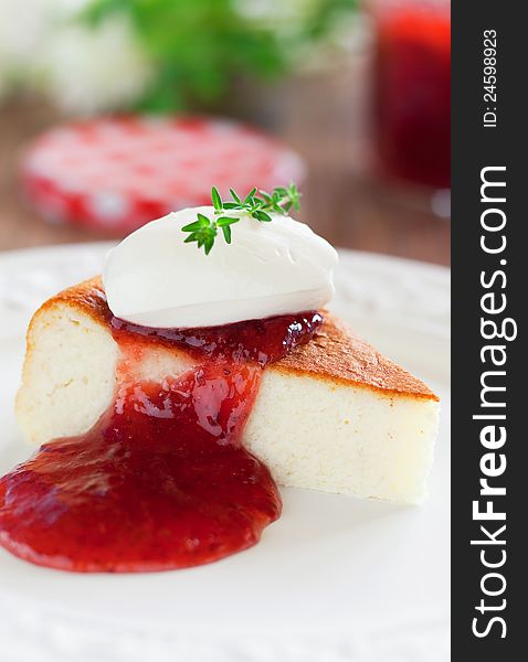 Cottage cheese cake with strawberry jam, selective focus