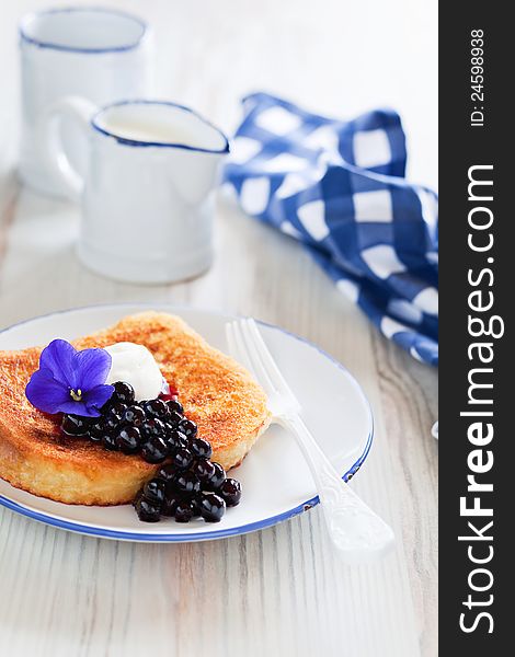French toast with currant violet syrup for breakfast, selective focus