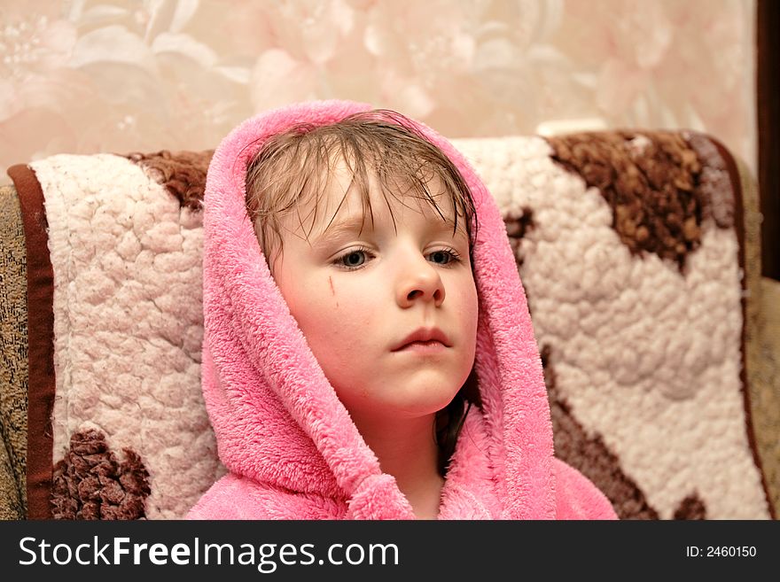 Girl in pink dressing gown at home. Girl in pink dressing gown at home