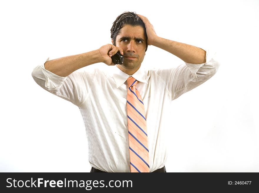 Young, vital businessman talking on his cell phone. Young, vital businessman talking on his cell phone.