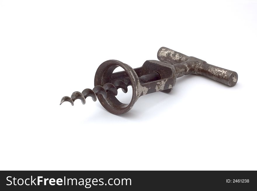 Isolated retro rusty corkscrew on white background