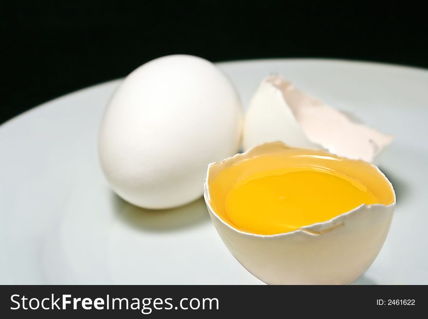 Chicken eggs on black background