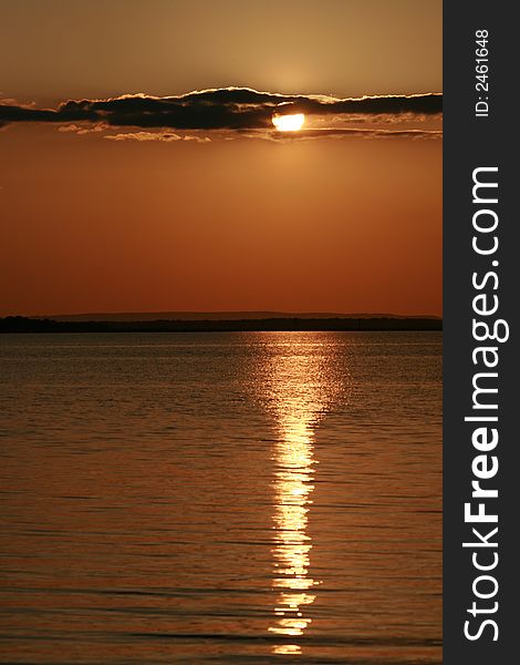 A beautiful color sun set on a beach. A beautiful color sun set on a beach