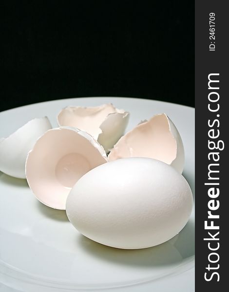 Chicken eggs on black background