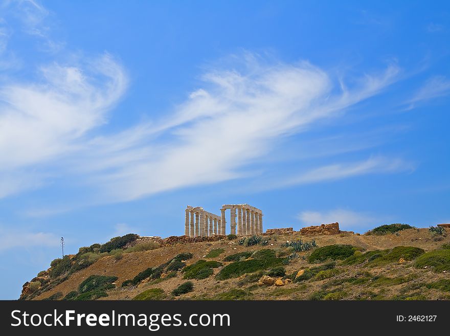 Poseidon temple, with Greek blue sky and amazing cloudscape. Poseidon temple, with Greek blue sky and amazing cloudscape.