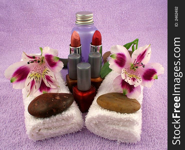 Lipsticks, nail polish, lotion, towels and stones. Lipsticks, nail polish, lotion, towels and stones.