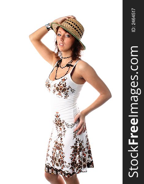 The girl in a sundress and a straw hat on a white background. The girl in a sundress and a straw hat on a white background