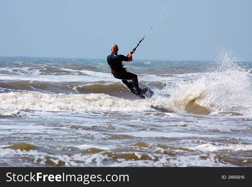 Kite surfing on a windy day