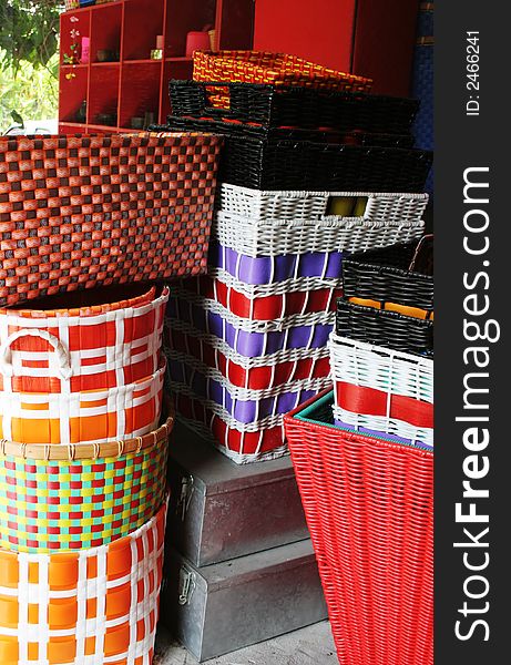 Colorful cane baskets stacked in a pile