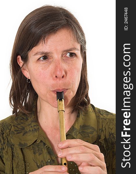 Mid-age woman playing flute over white background