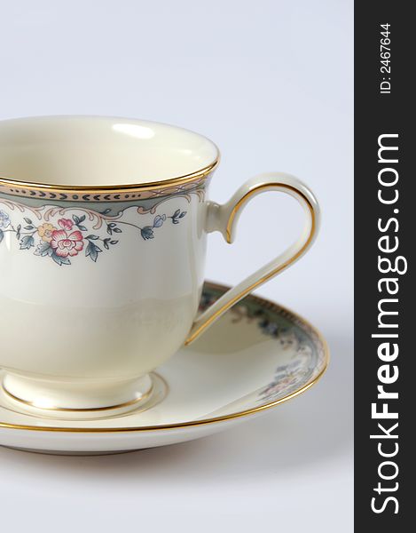 Close Up of Fine China Cup and Saucer over a white background