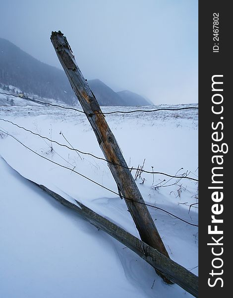 Fence in the mountains in winter