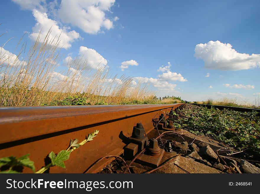 Train track detail and blue sky