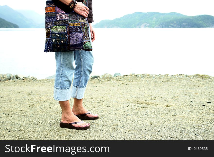 Women strolling along the beach at Harrison Hot Springs, BC. Women strolling along the beach at Harrison Hot Springs, BC