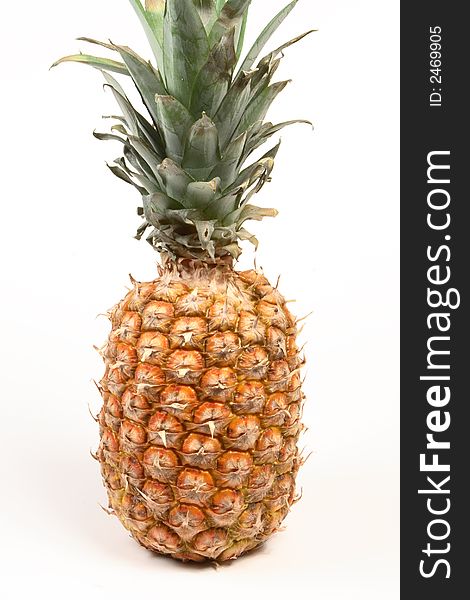 Ripe pineapple on a white background