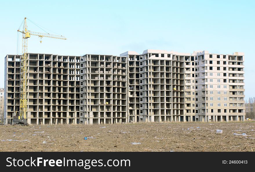 Construction site with crane and building