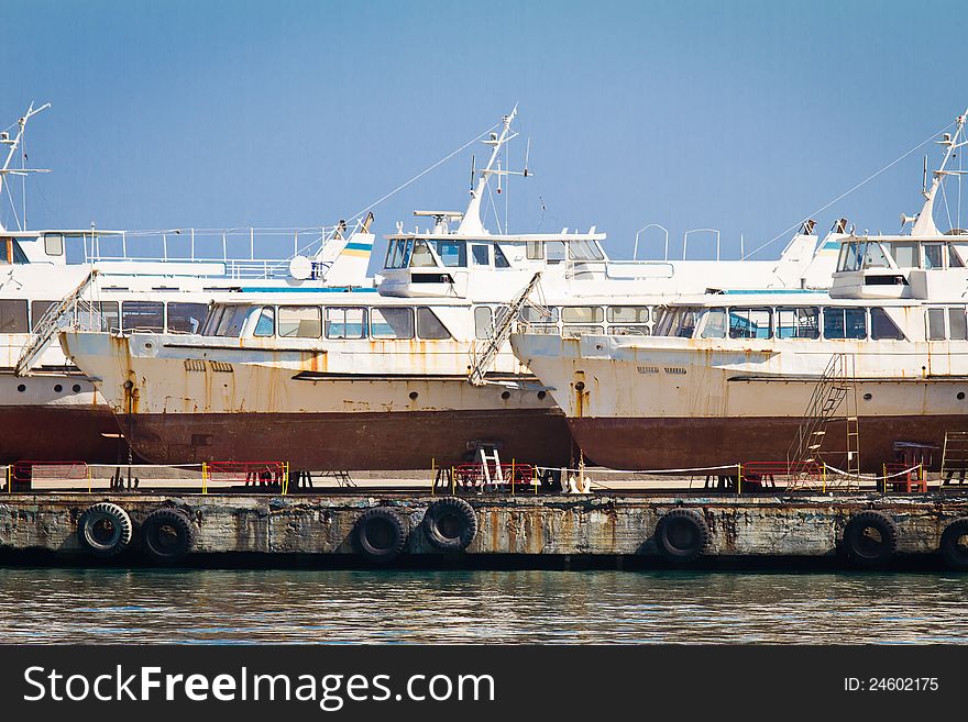 Abandoned boats in Yalta's harbor. Abandoned boats in Yalta's harbor