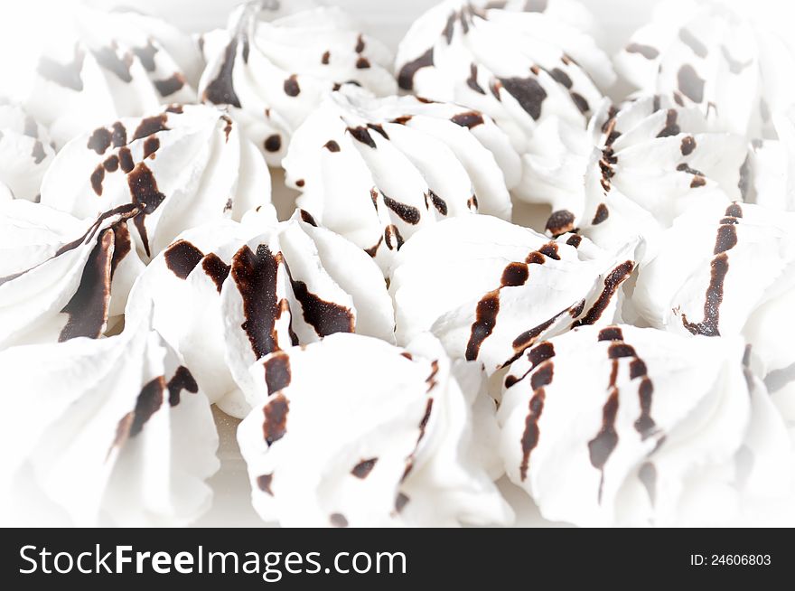 White meringue cookies with chocolate icing