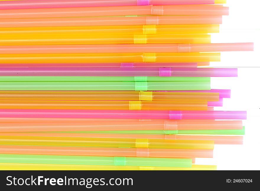 Many colored tubes for drinks on white background. Many colored tubes for drinks on white background