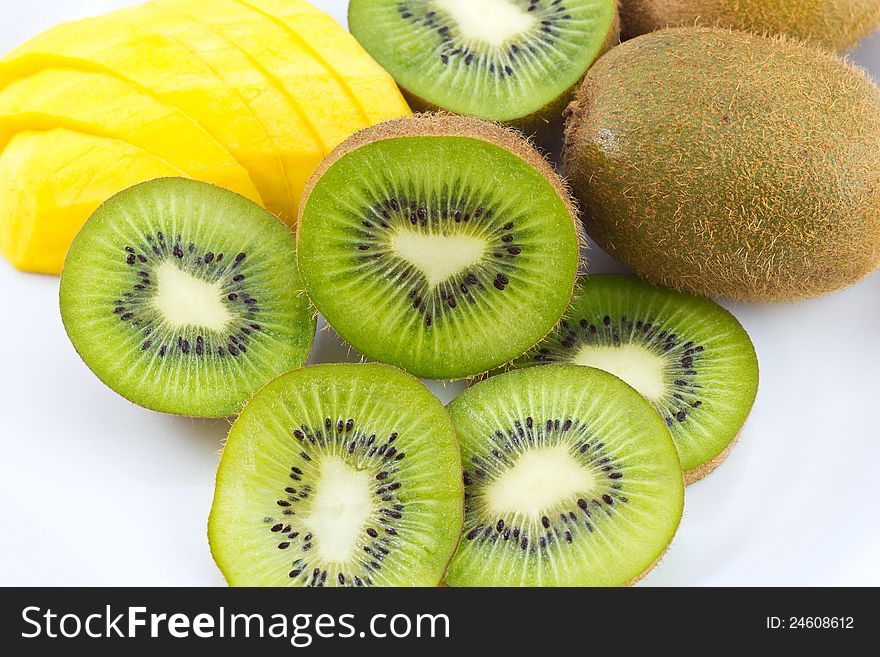 Kiwi and mango fruit on white background