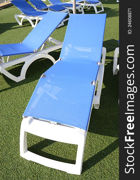 Blue deckchair on the grass