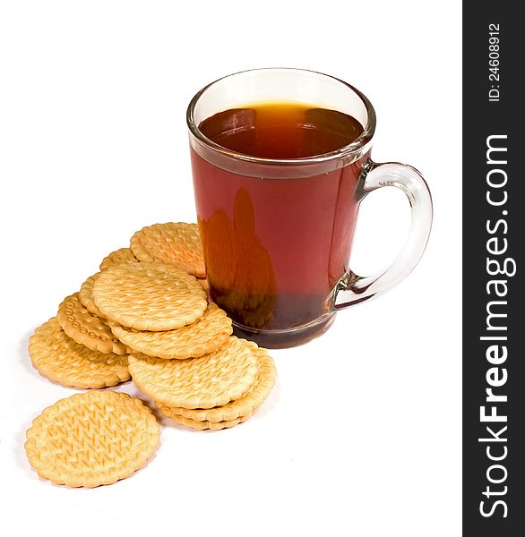 Glass cup of tea and cookies on a white background