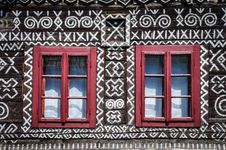 Red Windows On Wooden Wall Of Traditional Cottage Stock Photos