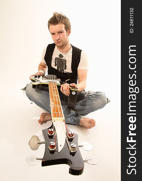 Young guy with a guitar playing rock and roll. Young guy with a guitar playing rock and roll