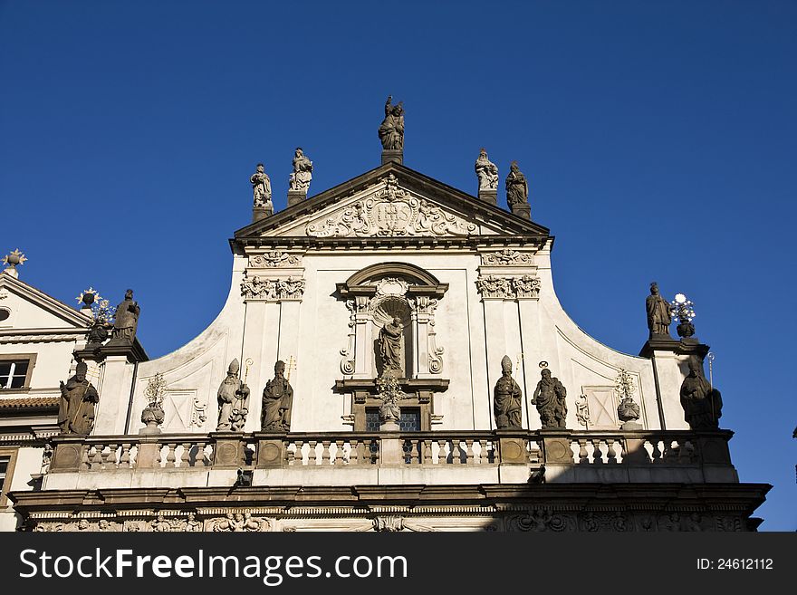 Balcony and gable house decorated with statues. Balcony and gable house decorated with statues