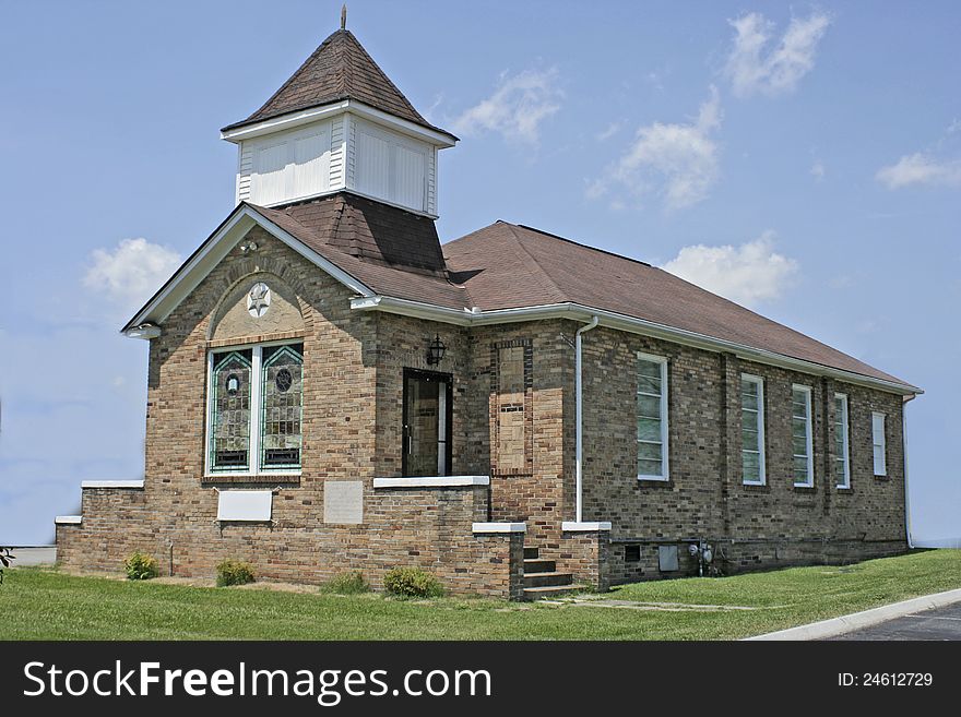 This rather old churchs sits atop a hill in the valley of The Great Smoky Mountains. It's been pressured washed and shines in the Tennessee sunshine. This rather old churchs sits atop a hill in the valley of The Great Smoky Mountains. It's been pressured washed and shines in the Tennessee sunshine.