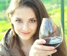 Red Wine. Woman Drinking Red Wine Stock Photography