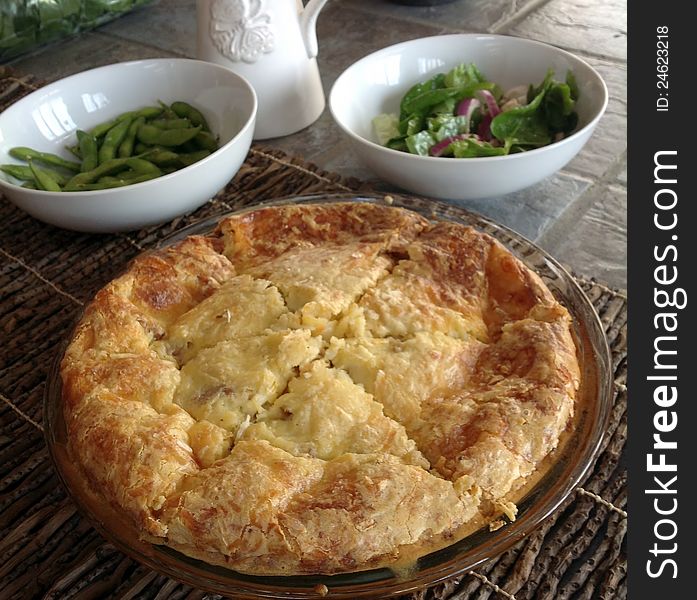 A crustless entre quiche pie made with biscuit mix, milk, eggs, cheese and spinach. This type of pie is also known as an Impossible Pie. A crustless entre quiche pie made with biscuit mix, milk, eggs, cheese and spinach. This type of pie is also known as an Impossible Pie.