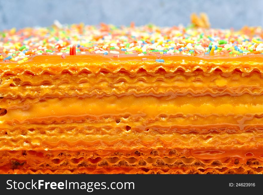 Waffles cake with caramel and colorful candies