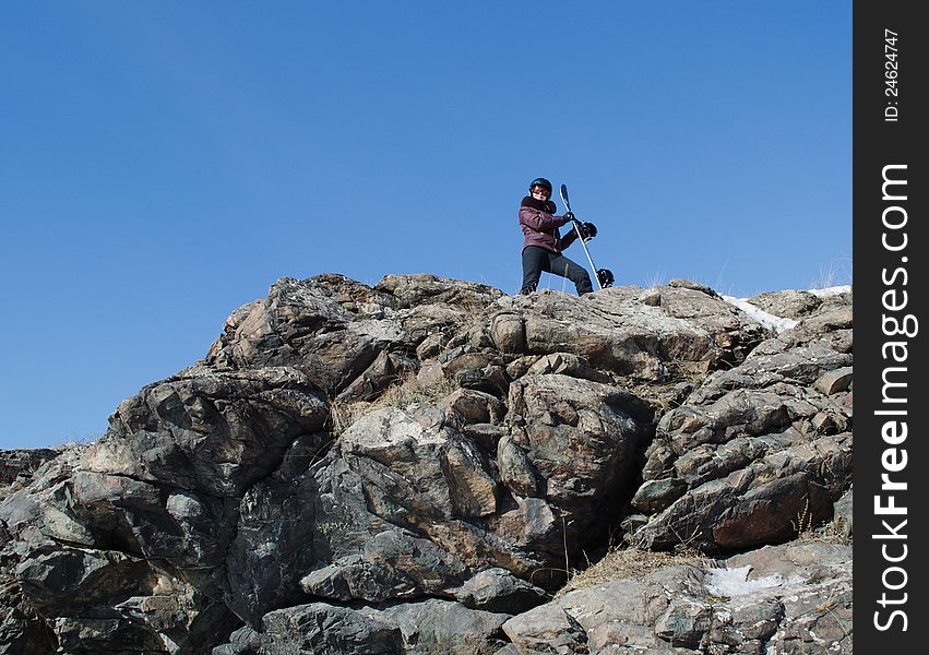 The Girl With A Snowboard On Mountain Top