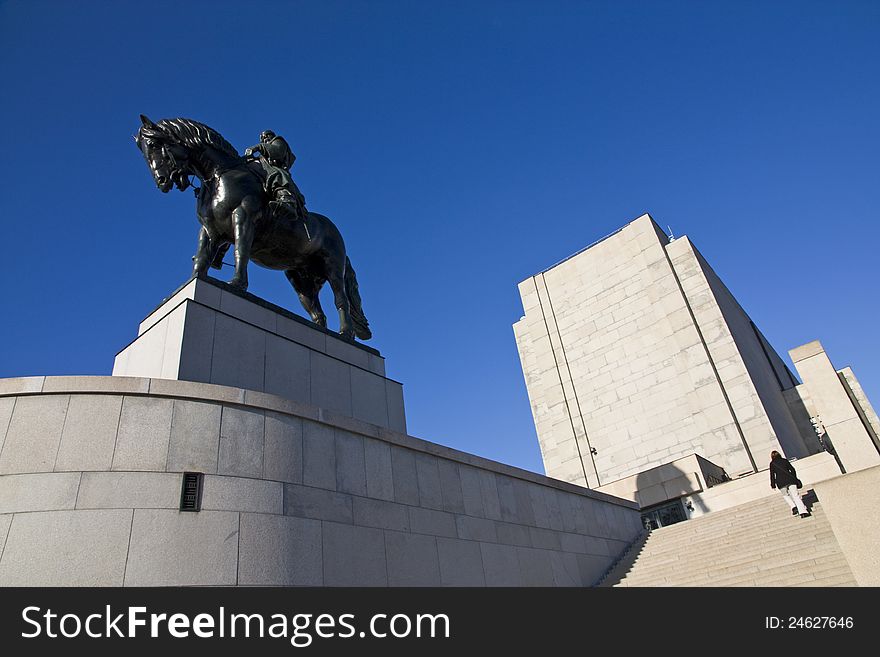 Metal sculpture of a horse and rider, monument in prague's tomb, commemoration of czech legionnaires, monument of concrete and stone, vítkov summer day with blue sky. Metal sculpture of a horse and rider, monument in prague's tomb, commemoration of czech legionnaires, monument of concrete and stone, vítkov summer day with blue sky