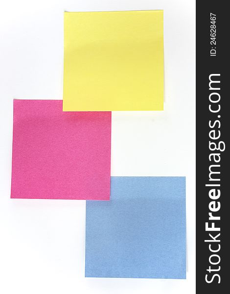 Yellow, pink and blue sticky notes over white background. Yellow, pink and blue sticky notes over white background