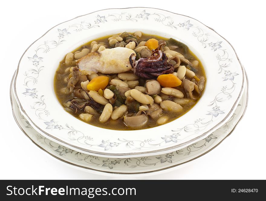 White kidney beans soup in decorated dish. White kidney beans soup in decorated dish