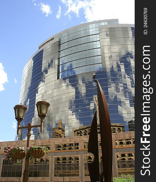 Other buildings reflecting onto 
windows of a tall skyscrapper. Other buildings reflecting onto 
windows of a tall skyscrapper