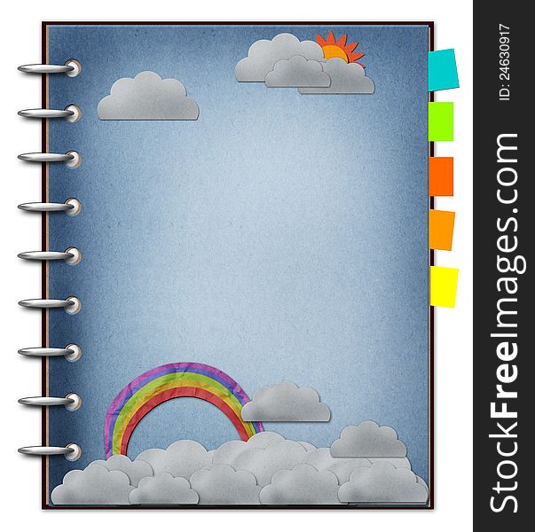 The art of rainbow and cloud create on recycled paper blank note book on blue sky. The art of rainbow and cloud create on recycled paper blank note book on blue sky.