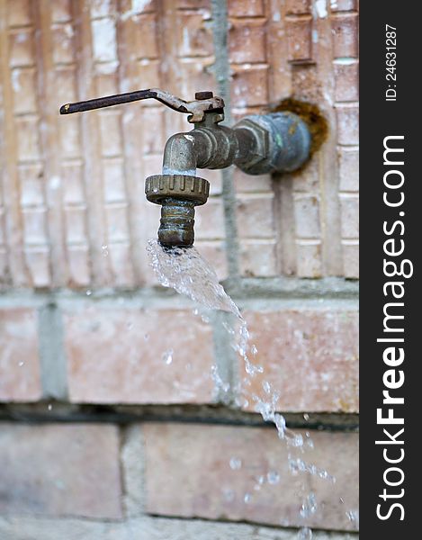 Waste of water - an old, leaky faucet. Waste of water - an old, leaky faucet