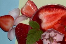 Close-up And Focus On A Glass Of Strawberry Juice With Deokaricoja Strawberry And Flower Head Red And White Under A Glass Of Straw Royalty Free Stock Image Close-up And Focus On A Glass Of Strawberry Juice With Deokaricoja Strawberry And Flower Head Red And White Under A Glass Of Straw Royalty Free Stock Image