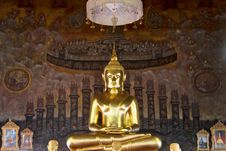 Golden Buddha Statue On Mural Background Royalty Free Stock Photo