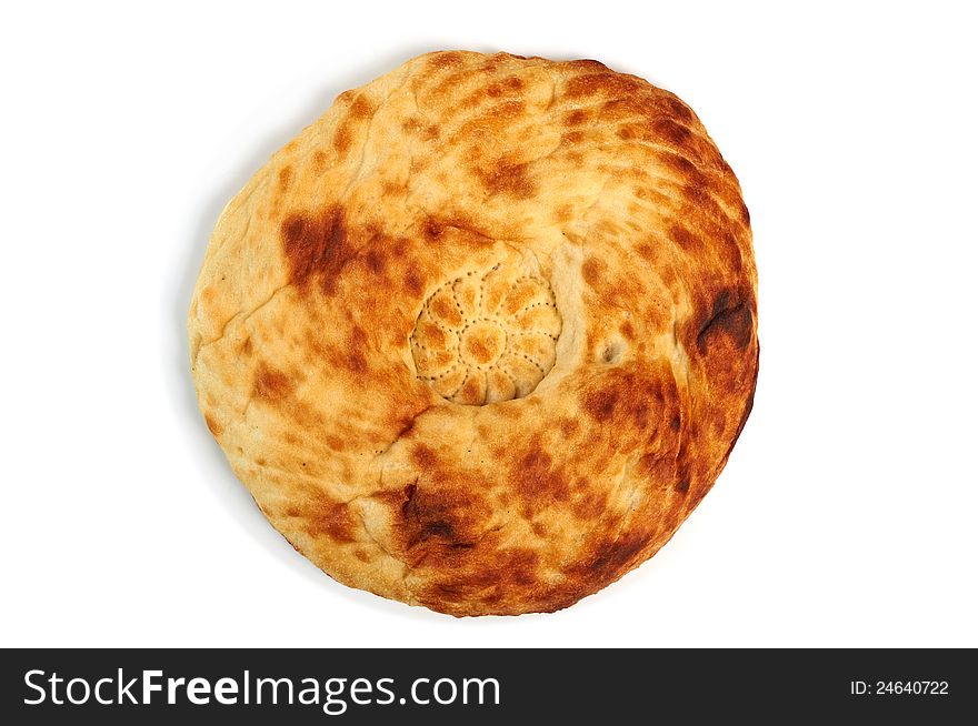 Hand-made Caucasian bread on white background with shadow