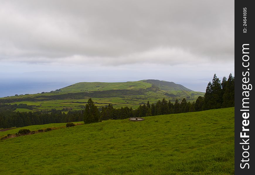 Green fields and grey clouds in Faial island. Green fields and grey clouds in Faial island