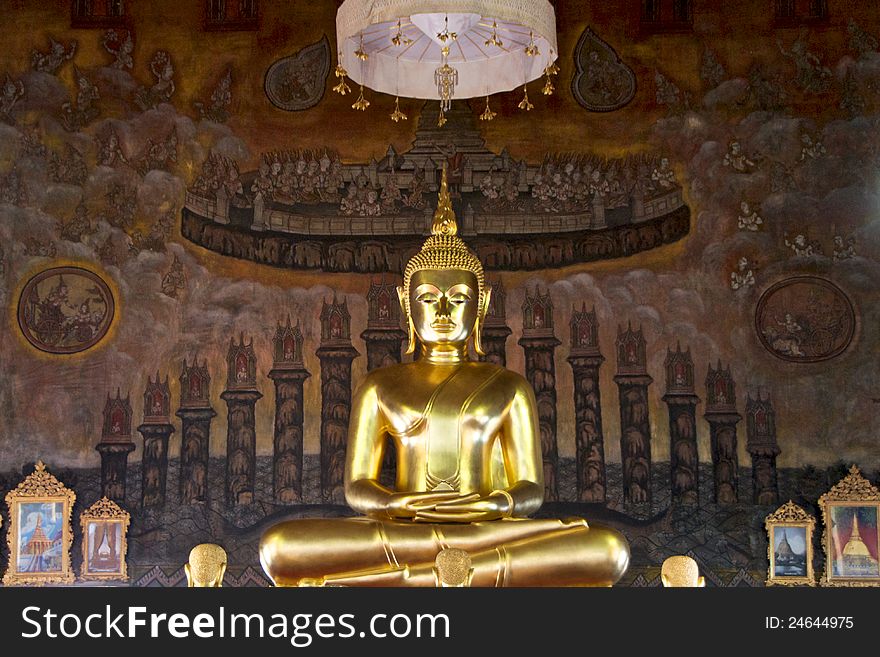 Golden buddha statue on ancient mural painting background in thai temple. Golden buddha statue on ancient mural painting background in thai temple