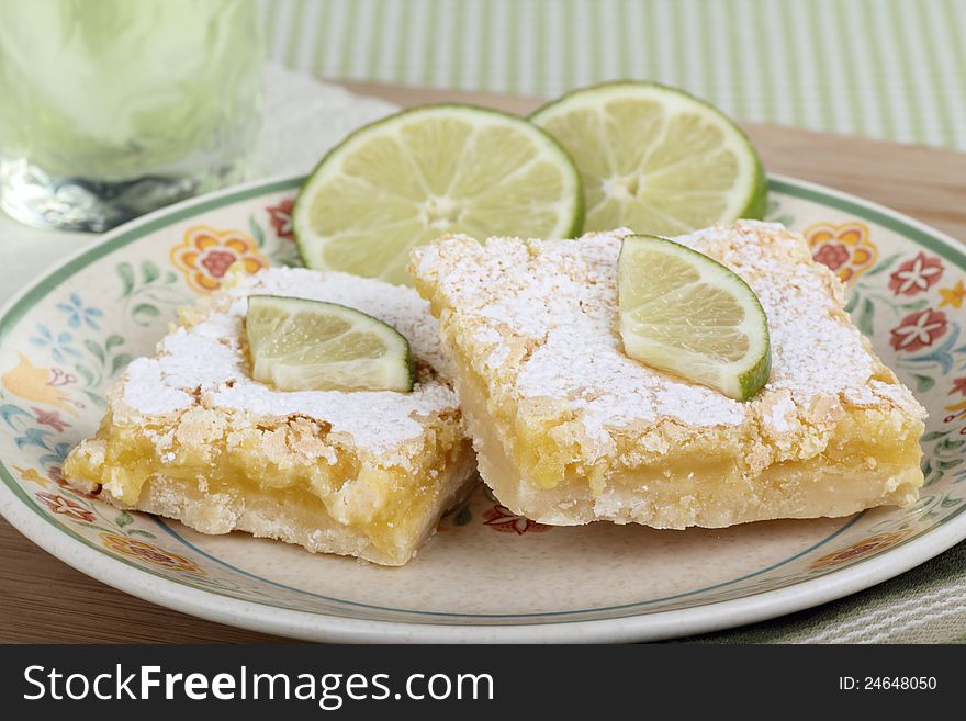 Two lime bars with lime slices on a plate