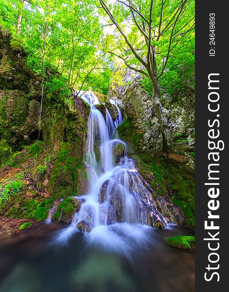 Peacefully Flowing Stream And Waterfalls