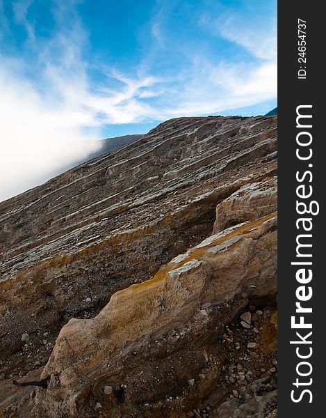 Volcano Ijen crater and clouds, East Java, Indonesia