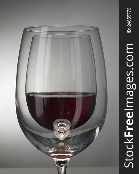 Wine in glass seen though other wineglass. Wine in glass seen though other wineglass