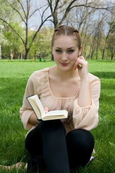 Woman Lies On Green Grass And Reads Book Stock Image Woman Lies On Green Grass And Reads Book Stock Image
